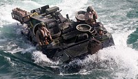 Marines with Amphibious Assault Platoon, Company E, Battalion Landing Team 2/6, load the unit's amphibious assault vehicles aboard the USS Oak Hill (LSD-51) during the 26th Marine Expeditionary Unit's Composite Training Exercise, July 19.