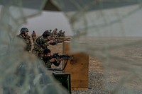 10th Special Operation Kandak Commandos conduct small arms barrier firing drills during a series of weapons proficiency ranges at Camp Pamir, Kunduz province, Afghanistan, Jan. 13, 2018.