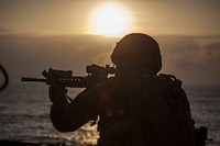 A Marine with Battalion Landing Team 1st Battalion, 5th Marines, 31st Marine Expeditionary Unit, fires at his target during a deck shoot aboard the USS Ashland (LSD 48), Feb. 27, 2016.