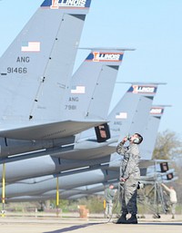 U.S. Air Force Staff Sgt. Cody Harpster, assigned to the 126th Aircraft Maintenance Squadron, Illinois Air National Guard, observes the tail of a KC-135R Stratotanker as the aircrew members perform pre-flight checklist items at Scott Air Force Base, Ill, March 29, 2016.