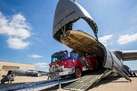 Loadmasters with the 439th Airlift Wing, Air Force Reserve Command, load a 1982 Mack 1250 GPM pumper fire truck onto a C-5B Galaxy at Joint Base McGuire-Dix-Lakehurst N.J., Aug. 12, 2016.