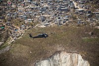 A U.S. Army UH-60 Black Hawk helicopter with Joint Task Force-Bravoâs 1st Battalion, 228th Aviation Regiment, deployed in support of Joint Task Force Matthew, flies toward a supply distribution point in Jeremie, Haiti, Oct. 10, 2016.