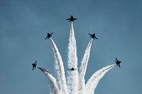 F-18 Hornets, with the Navy's Flight Demonstration Team "The Blue Angels," perform an aerial demonstration during Air Show Baltimore in Maryland, Oct. 15, 2016.