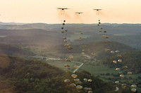 U.S. Soldiers with the 173rd Airborne Brigade, as well as soldiers from allied nations, parachute from U.S. Air Force C-130 aircraft onto a drop zone in Germany, Sept. 19, 2018.