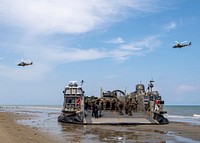 A U.S. Navy landing craft air-cushion (LCAC), attached to Assault Craft Unit (ACU) 5, sits on the beach during a simulated air assault while conducting Cooperation Afloat Readiness and Training (CARAT) 2018 at Tanduo Beach, Malaysia, Aug. 17, 2018.