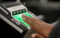 U.S. Customs and Border Protection officers screen international passengers arriving at the Dulles International Airport in Dulles, Va., November 29, 2016.