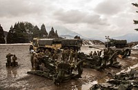 U.S. Marines and Sailors with Alpha Battery, 1st Battalion, and 12th Marines attached to Alpha Battery, 3D Battalion, make final preparations before heading to the field in the Hijudai Maneuver Area, Japan, Feb. 24, 2017.