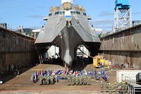 The crew of USS Coronado (LCS 4) listens as Capt. Matthew McGonigle, commodore, Commander, Littoral Combat Ship Squadron ONE, gives a speech during the ship’s change of command ceremony at Vigor Shipyard in Portland, Oregon, May 3, 2019.