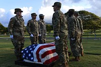 A detail of Defense POW/MIA Accounting Agency (DPAA) personnel prepare to transport a casket during a disinterment ceremony at the National Memorial Cemetery of the Pacific, Honolulu, Hawaii, March 27, 2017.