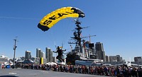 Retired U.S. Navy SEAL Jim Woods, a member of the U.S. Navy Parachute Team, the Leap Frogs, comes in for a landing during a skydiving demonstration above the USS Midway Museum in San Diego March 29, 2017.