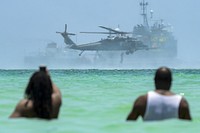 Spectators view an aerial demonstration during the National Salute to America’s Heroes Air and Sea Show, May 28, 2017, at Miami Beach, Fla. Top tier U.S. military assets assembled in Miami to showcase air superiority while honoring those who have made the ultimate sacrifice during the Memorial Day weekend.