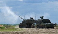 U.S. Soldiers assigned to Bravo Battery, 3rd Battalion, 29th Field Artillery Regiment, 3rd Armored Brigade Combat Team, 4th Infantry Division, load a M109A6 Paladin during the table six certification live-fire May 25, 2017 at Camp Karliki Range, Poland.