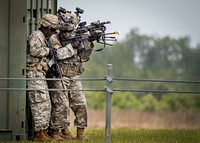 A U.S. Army Ranger fire team prepares to enter a building during a demonstration at the 6th Ranger Training Battalion’s open house event at Eglin Air Force Base, Fla., April 29, 2017.