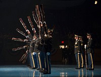 Members of The U.S. Army Drill Team perform at the 242nd Army Birthday Twilight Tattoo, June 14, 2017, at Conmy Hall, Joint Base Myer-Henderson Hall, Va. Twilight Tattoo is an hour-long, live-action military performance featuring performances by Soldiers from the 3rd U.S. Infantry Regiment (The Old Guard) and The U.S. Army Band "Pershing's Own.&rdquo; (U.S. Army photo by Staff Sgt. Austin L. Thomas) Original public domain image from Flickr