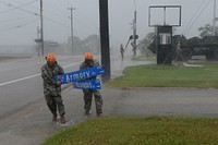 U.S. Soldiers with the 386th Engineer Battalion, Texas Army National Guard, pick up large debris in the wake of Hurricane Harvey in Victoria, Texas, Aug. 26, 2017.