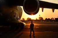 U.S. Air Force Capt. Keane Carpenter, an aircraft commander with the 14th Airlift Squadron, Joint Base Charleston, S.C., performs a walk around safety check of his assigned C-17 Globemaster III aircraft on the flight line at Scott Air Force Base, Illinois, Sept. 10, 2017.