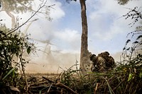 U.S. Marines shield themselves from dust as an MV-22 Osprey tiltrotor aircraft takes off from Shoalwater Bay Training Area in North Queensland, Australia, July 19, 2017, during Exercise Talisman Saber 17.