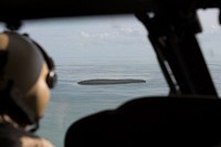 One of many islands of the Florida Keys appears in the forward window of a U.S. Customs and Border Protection Air and Marine Operations Black Hawk helicopter as air interdiction agents conduct a media flight into the Florida Keys to survey the damage from Hurricane Irma September 12, 2017.