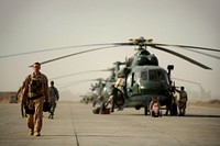 U.S. Air Force Capt. Bryan Tuinman, an Mi-171 helicopter pilot with the 721st Air Expeditionary Advisory Squadron, walks down a flight line prior to a mission at Taji Air Base, Iraq, July 15, 2009.