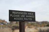 A sign marks a restoration area near Hemingway Buttress