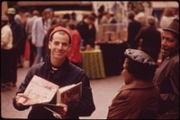 Fountain Square in Downtown Cincinnati Is a Public Square That Works for the City and Its People in a Myriad of Ways: Distributing Hare Krishna Literature at the Israeli Birthday Celebration 05/1973. Photographer: Hubbard, Tom. Original public domain image from Flickr
