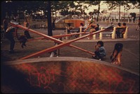 Kids Enjoying Playground Equipment in East River Park in Manhattan, New York City. The Inner City Today Is an Absolute Contradiction to the Main Stream America of Gas Stations Expressways, Shopping Centers and Tract Homes.