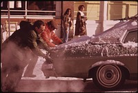 Helping Hands Will Get This Skier's Car off the Ice 02/1974. Photographer: Hoffman, Ron. Original public domain image from Flickr