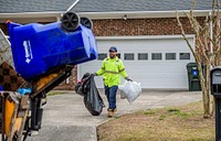 Worker taking the trash out, Greenville, date unknown. Original public domain image from Flickr