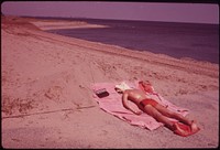 Lifeguard Takes a Sunbath at Great Kills Park on Staten Island 05/1973. Photographer: Tress, Arthur. Original public domain image from Flickr