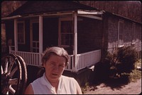 Lilly Mae Sheets, Fireco, West Virginia, near Beckley, Stands Outside Her Raleigh County Home. Her Husband Was Hurt by a Roof Fall in the Mines in November, 1973, and Did Not Receive Workman's Compensation until March, 1974 05/1974. Photographer: Corn, Jack. Original public domain image from Flickr