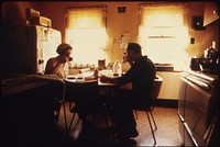 Mr. And Mrs. Wallace A. Wolf Eating Breakfast before He Leaves for His Job as an Automotive Mechanic for the City. He Is a Native of the Town Whose Mother and Grandmother Still Reside There.