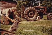A 60-Year-Old Bachelor Farmer from Beanville, near Randolph, Vermont, Adjusts the Blades of His Mower before Going Out to Hay. Before the Season Ends, He Will Have Filled His Barn with Fifty Tons of Loose Hay All Raked and Pitched by Hand 07/1974.