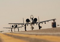 Two U.S. Air Force A-10C Thunderbolt II aircraft from the 354th Expeditionary Fighter Squadron taxi at Kandahar Air Field, Afghanistan, Jan. 1, 2010.