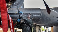 U.S. Air Force Airman 1st Class Keon Oliver, 355th Aircraft Maintenance Squadron weapons load crew member, hoses down an A-10 Thunderbolt II with a rinse gun at Davis-Monthan Air Force Base, Ariz., July 24, 2018.