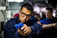 180727-N-LI768-1026 PACIFIC OCEAN (July 27, 2018) – Information Systems Technician Seaman Apprentice Dominick Bolanos, from Crystal Lake, Ill., participates in security reaction force training aboard the guided-missile destroyer USS Dewey (DDG 105).