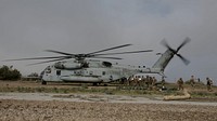 U.S. Marines with Marine Wing Support Squadron (MWSS) 373, Marine Wing Support Group (MWSG) 37, 3rd Marine Aircraft Wing (MAW), unload gear from a CH-53E Super Stallion on the runway at Airport in the Sky on Catalina Island, California, Jan. 9, 2019.