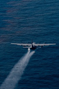 A U.S. Air Force C-130 Hercules aircraft from the 910th Airlift Wing out of Youngstown-Warren Air Reserve Station, Ohio, drops an oil dispersing chemical over the Gulf of Mexico May 5, 2010.