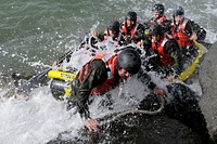 Students in Basic Underwater Demolition/SEAL Class 282 participate in rock portage in Coronado, Calif., April 13, 2010.