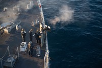 U.S. Sailors with the small craft action team man and fire a .50-caliber machine gun on the forecastle of the Harpers Ferry-class amphibious dock landing ship USS Harpers Ferry (LSD 49) during a live-fire exercise in the Pacific Ocean, March 17, 2019.