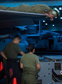 U.S. Marines with Marine Fighter Attack Squadron (VMFA) 211, 13th Marine Expeditionary Unit (MEU), teach a class on basic air-cart operations aboard the Wasp-class amphibious assault ship USS Essex (LHD 2) in the Arabian Sea Dec. 29, 2018.