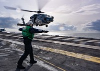 Aviation Machinist’s Mate 3rd Class Terrence Miller, from Slidell, La., assigned to the “Wolf Pack” of Helicopter Maritime Strike Squadron (HSM) 75, signals a MH-60R Sea Hawk helicopter on the flight deck of the aircraft carrier USS Theodore Roosevelt (CVN 71) in the Pacific Ocean May 12, 2019.