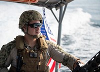 U.S. Navy Petty Officer 1st Class Alexander Weigel, engineer under instruction, Coastal Riverine Squadron 8 (CRS 8), Combined Joint Task Force-Horn of Africa, Camp Lemonnier, Djibouti, mans a security post on a Rigid Hull Inflatable Boat (RHIB) while en route to provide armed security escort in the Gulf of Tadjourah, Dec. 7, 2018.