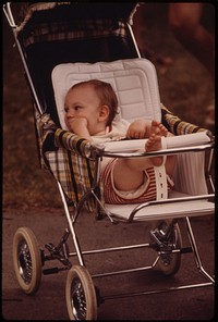 Youngster in a Stroller Awaits His Family in New Ulm Minnesota.
