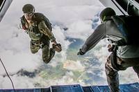 A U.S. service member jumps out of a CH-53E Super Stallion during parachute training operations over Marine Corps Training Area Bellows, Hawaii, August 14, 2019.