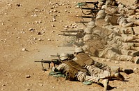 U.S. Navy Seabees from Naval Mobile Construction Battalion 40 fire M-4 and M-16A2 rifles during weapons qualification training near Camp Mike Spann, Afghanistan, Oct. 1, 2010.