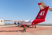 A ground crew loads fire retardant into an air tanker at the Boise Tanker Base. (DOI/Neal Herbert).