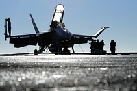 U.S. Sailors assigned to Strike Fighter Squadron 154 prepare a Navy F/A-18F Super Hornet aircraft for the first launch cycle of the day aboard USS Ronald Reagan (CVN 76) Nov. 2, 2010, while under way in the Pacific Ocean.
