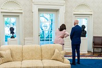 President Joe Biden and Vice President Kamala Harris look out the widows of the Oval Office of the White House, Thursday, August 5, 2021, prior to a Congressional Gold Medal bill signing event to honor U.S. Capitol Police in the Rose Garden.