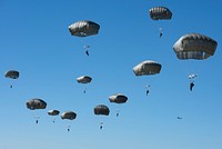Army paratroopers assigned to the 4th Infantry Brigade Combat Team (Airborne), 25th Infantry Division, U.S. Army Alaska, jump from a U.S. Marine Corps KC-130J Super Hercules while conducting airborne training over Malemute Drop Zone at Joint Base Elmendorf-Richardson, Alaska, May 25, 2021.