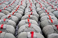 Reserve parachutes are returned after a successful jump by paratroopers assigned to the 4th Infantry Brigade Combat Team (Airborne), 25th Infantry Division, U.S. Army Alaska, at Malemute Drop Zone on Joint Base Elmendorf-Richardson. Original public domain image from Flickr